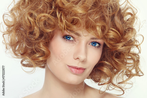 Vintage style portrait of young beautiful sexy woman with curly hair