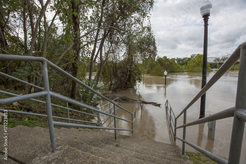 Wide shot of flooded town in Texas looking down steps