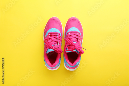 Sport shoes on yellow background