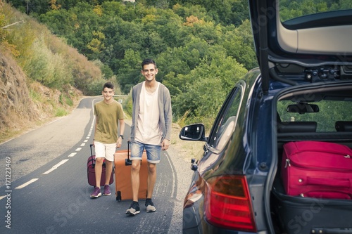 people travelling by car, holidays and luggage © carballo