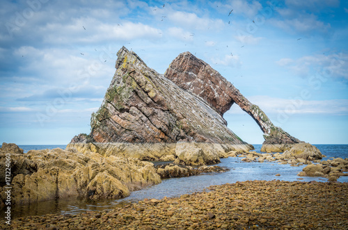 Bow Fiddle Rock, natural sea arch near Portknockie on the north-eastern coast of Scotland. photo