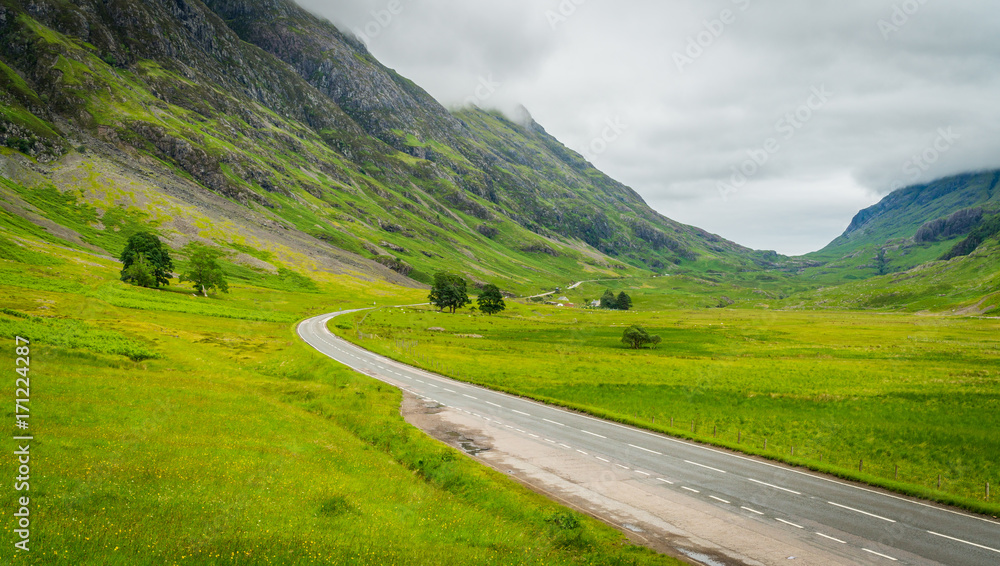 Scenic sight in a cloudy summer afternoon in Glencoe, Scottish Highlands.