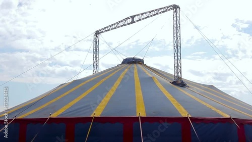 Colorful circus big top tent against a blue sky photo