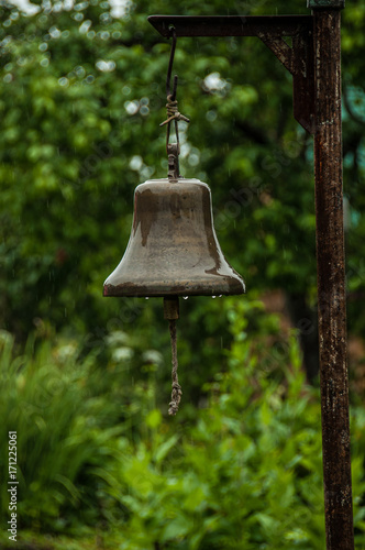 A ship bell in a retired sailor's garden