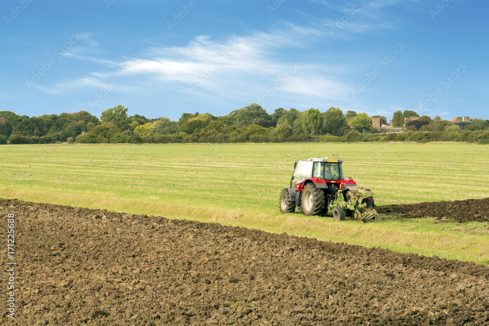 Fototapeta premium tractor ploughing a filed essex uk