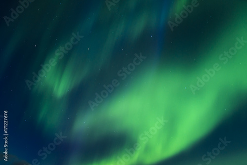 Incredibly bright Aurora borealis (Northern lights)  over the Iceland