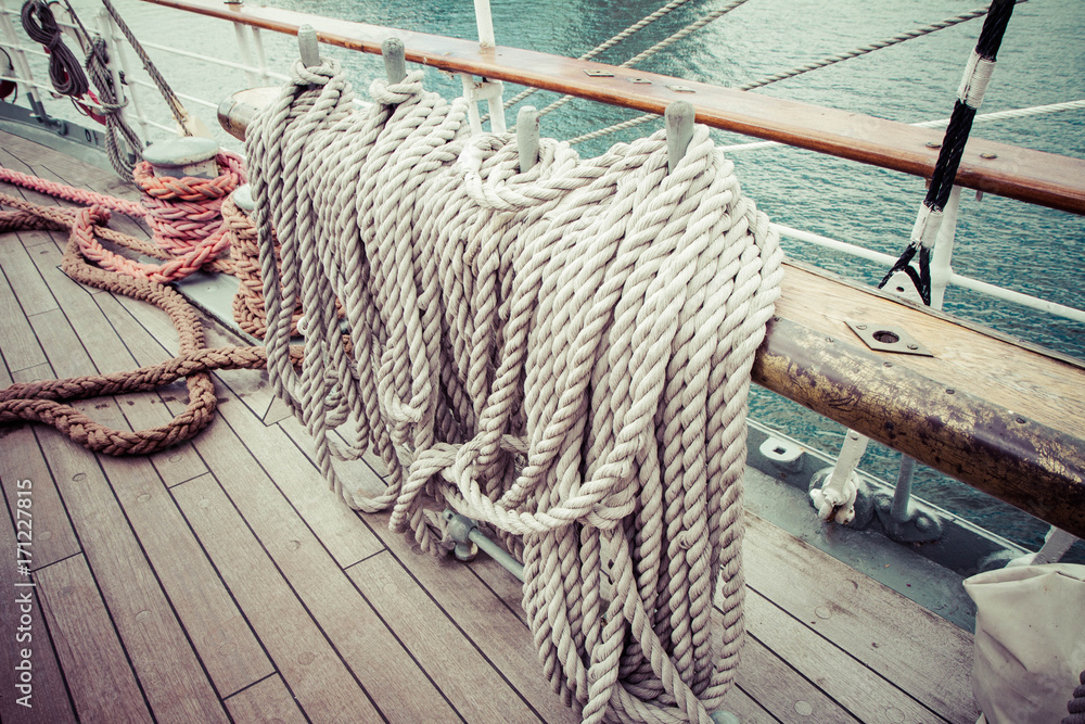Thick rope on a deck of a ship Stock Photo
