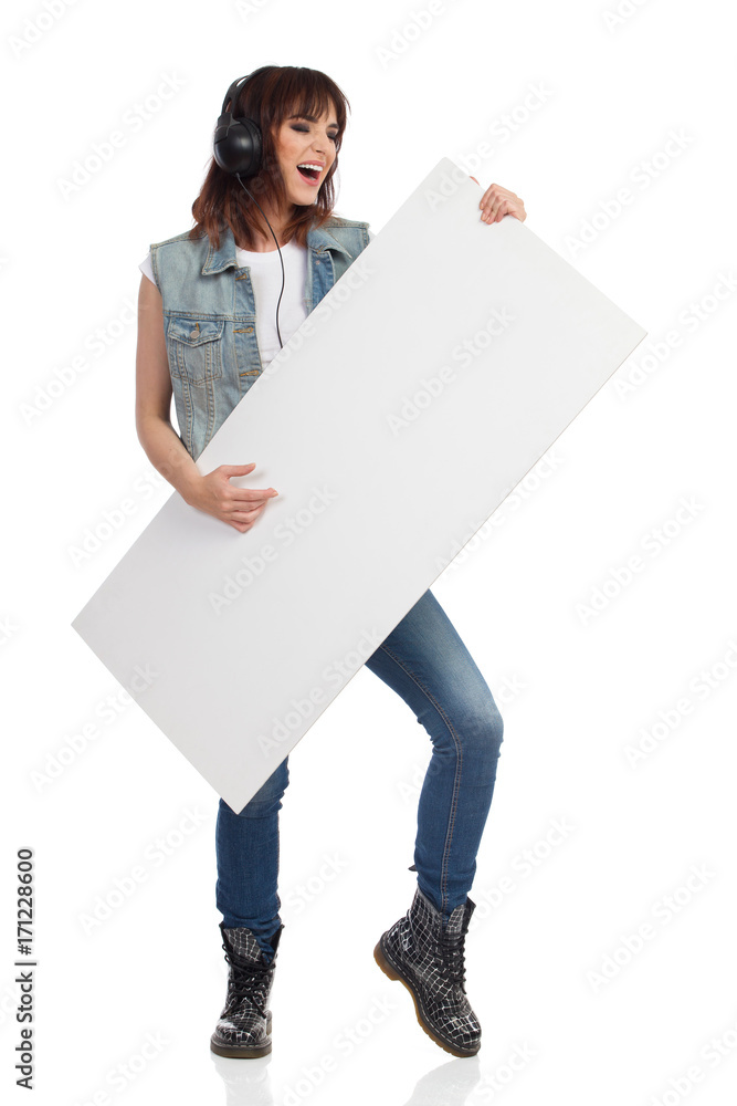 Singing Woman Is Holding White Banner And Pretending Playing the Guitar Singing Woman Is Holding White Banner And Pretending Playing the Guitar