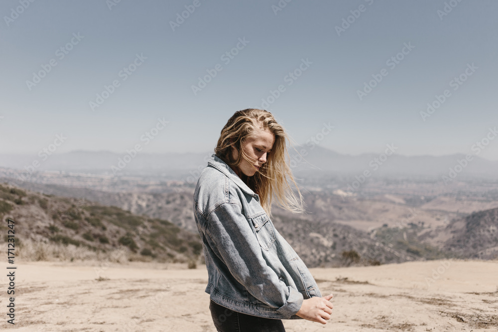 blonde fashionable woman in the desert mountains blonde fashionable woman in the desert mountains