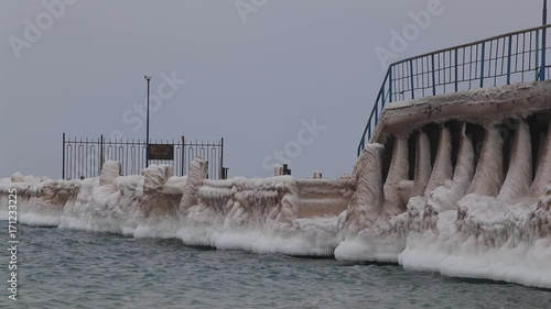 marina is very cold in the winter covered with ice after a storm