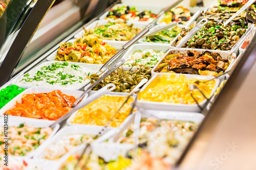 Display with Meze appetizers in delicatessen shop put on display
