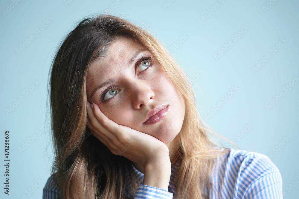 Young woman with head on a hand Young woman with head on a hand