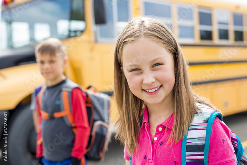 Great Portrait Of School Pupil Outside Classroom Carrying Bags