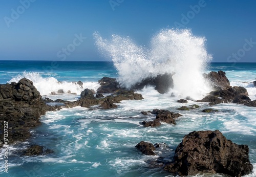 Ocean waves crashing against rocks at Hawaii beach