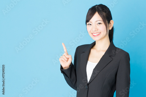 Fotografie portrait of asian businesswoman isolated on blue background