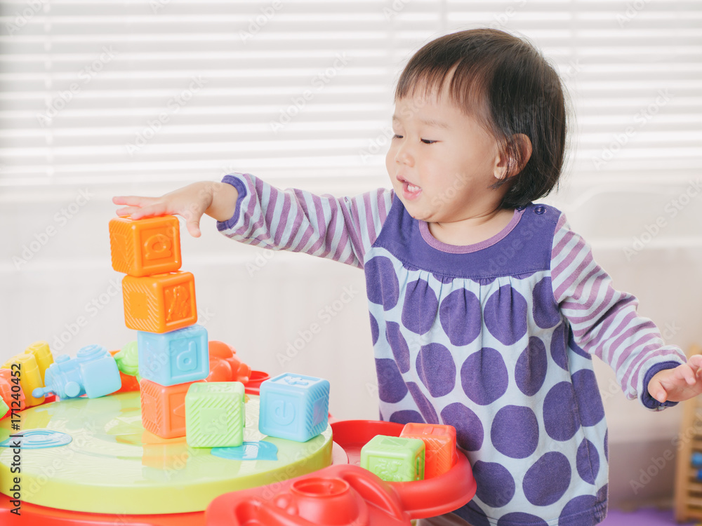 baby girl playing toy at home baby girl playing toy at home