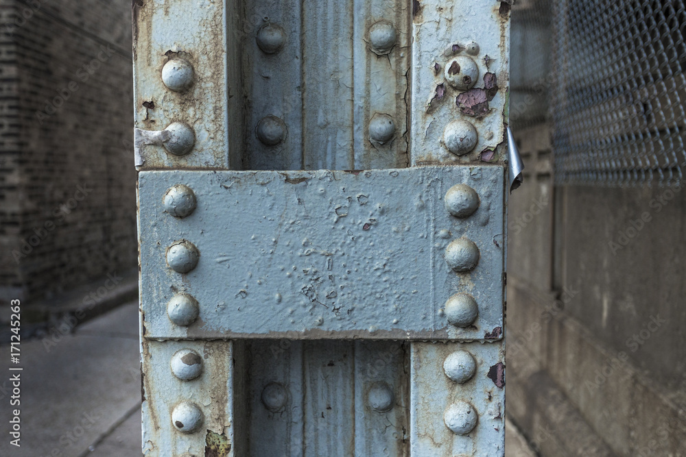 Closeup of a metal support for an overhead subway track