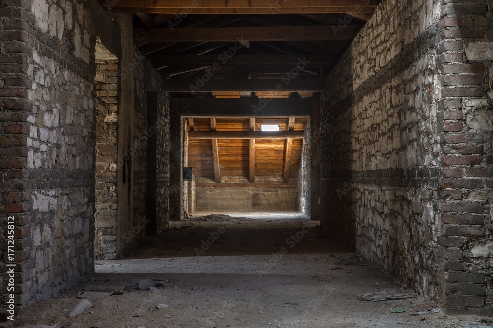 Fototapeta Creepy attic interior at abandoned building