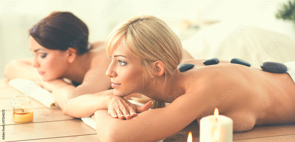 Two young beautiful women relaxing and enjoying at the spa cent Two young beautiful women relaxing and enjoying at the spa cent