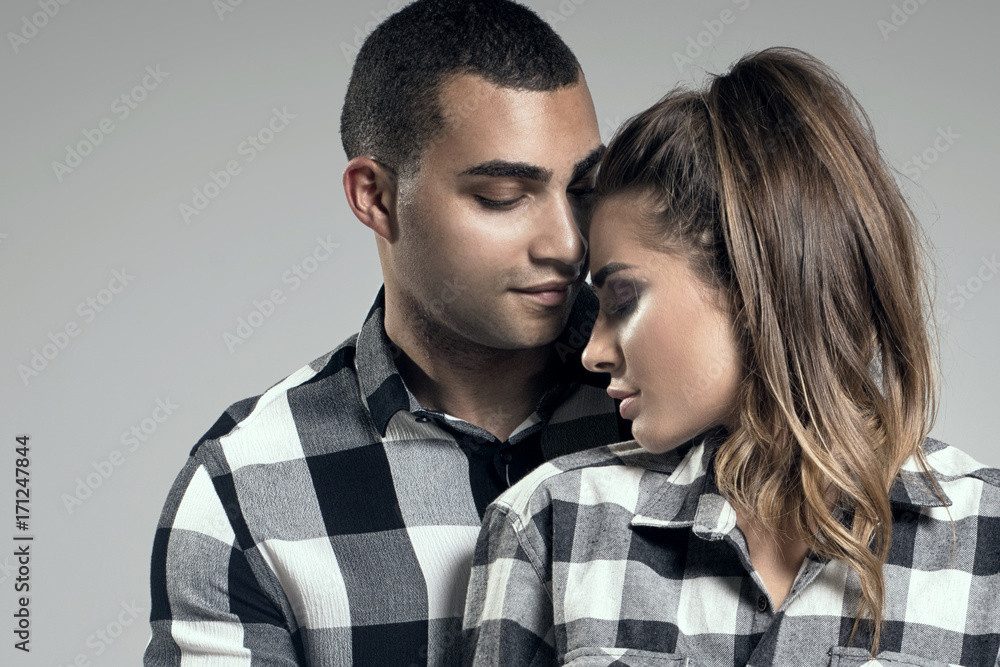 Beautiful couple posing in studio. Beautiful couple posing in studio.