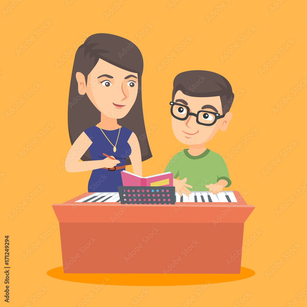 Little caucasian boy in glasses having a piano lesson with a teacher. Young piano  teacher giving