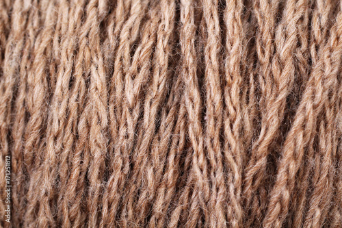 A super close up image of brown yarn