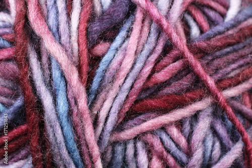 A super close up image of pastel colored yarn 