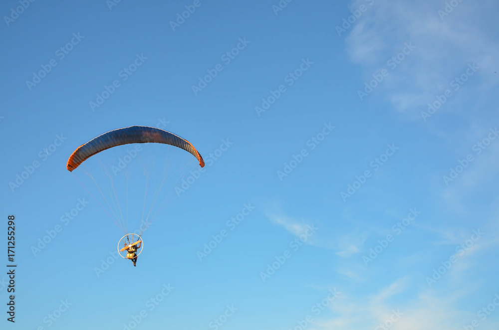 Paramotor flying on the sky