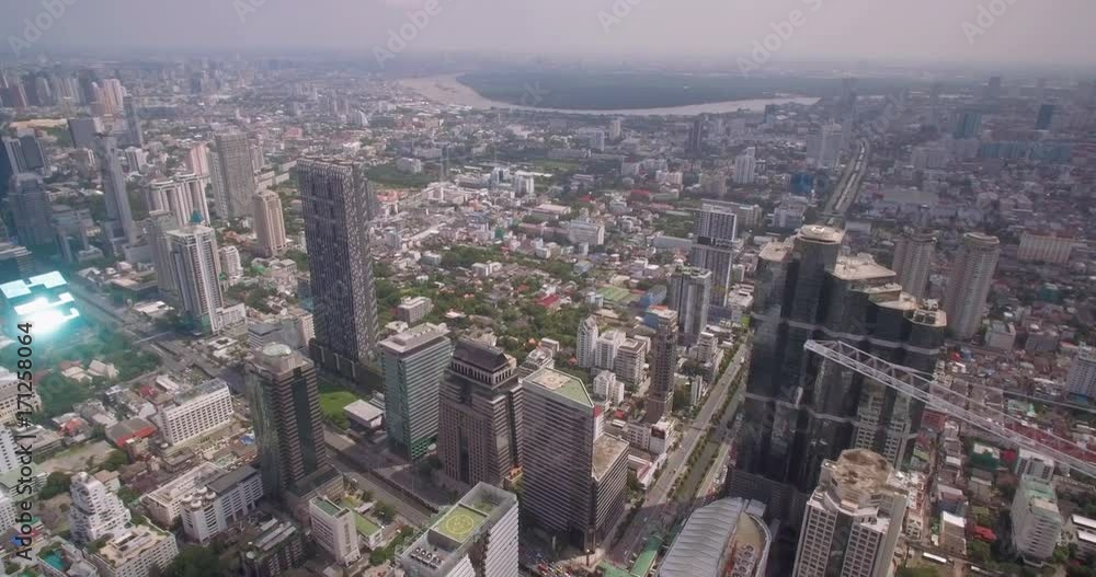High Aerial Shot Over Skyscrapers In Sathorn District, Bangkok, Thailand
High Aerial Shot Over Skyscrapers In Sathorn District, Bangkok, Thailand