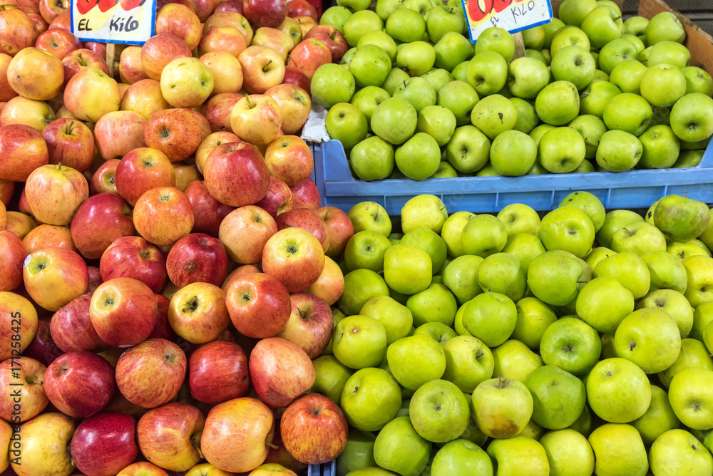 Fresh red and green apples for sale at a market Fresh red and green apples for sale at a market