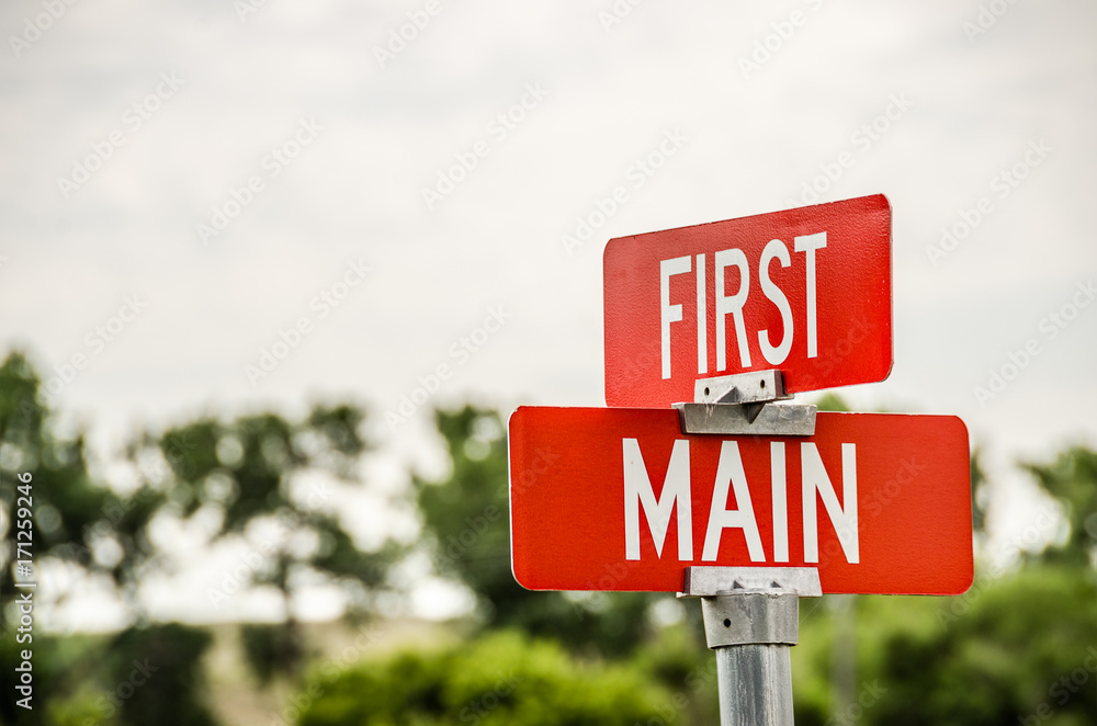 First and Main on Red Signs with White Letters