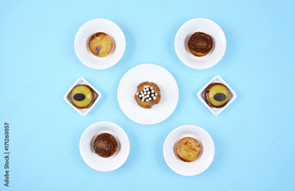 Delicious various pastries on trendy blue background. Delicious various pastries on trendy blue background.