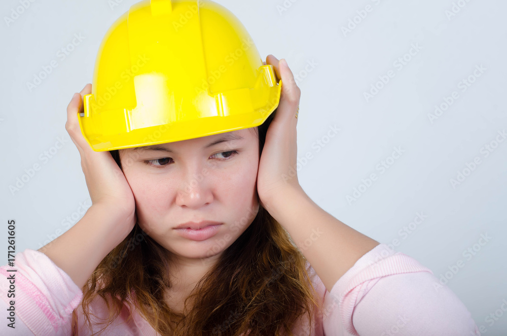 Young engineer woman with yellow safety hard hat isolated,