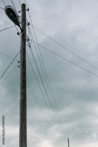 Wallpaper Mural village wooden street lamp post with lantern and wires on clouds background Torontodigital.ca