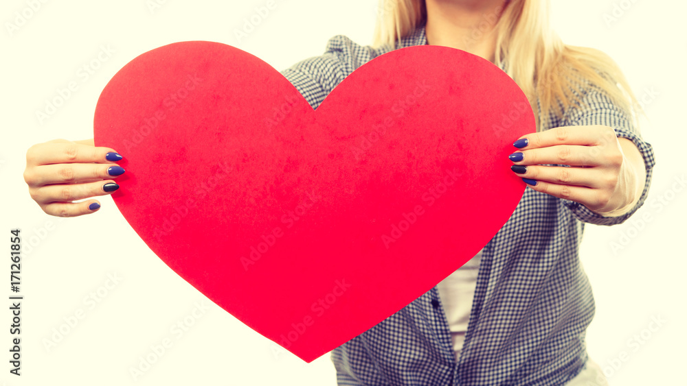 Woman holding big red heart, love sign Woman holding big red heart, love sign