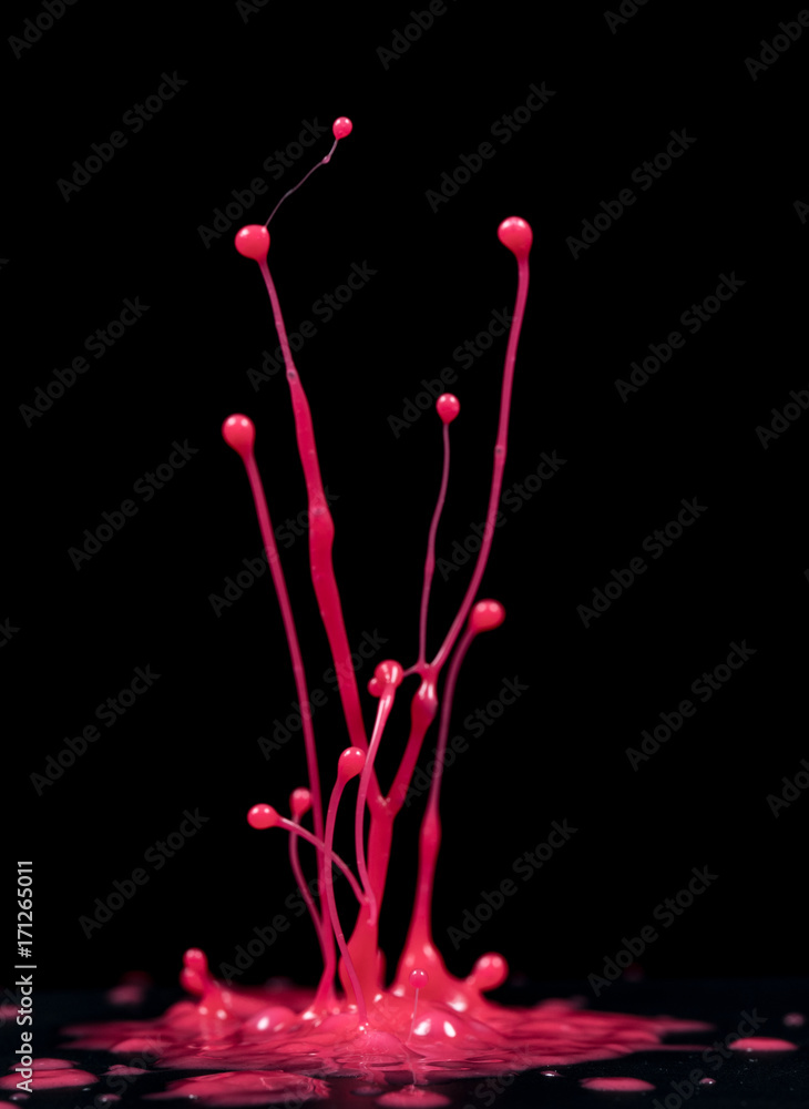 spray paint or ink in ultraviolet light on a black background spray paint or ink in ultraviolet light on a black background