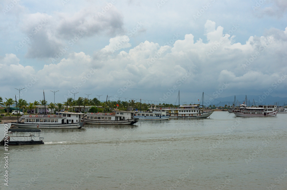 Cruise boats and ships at berth at bay. Vietnam