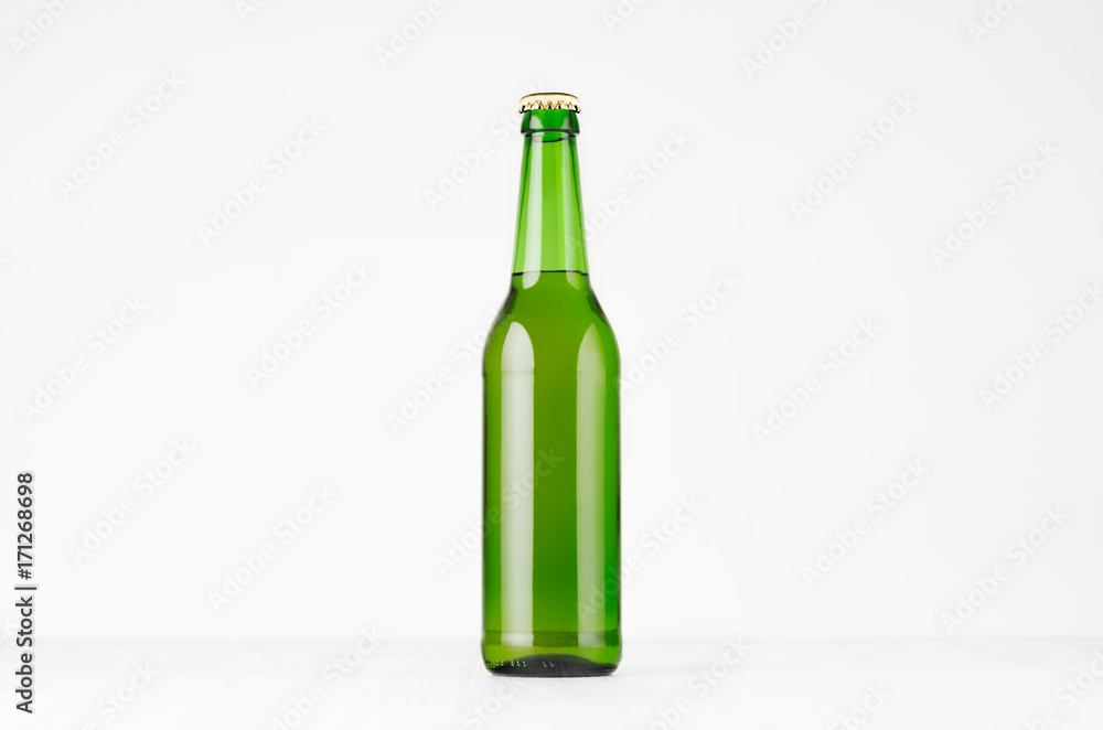 Green longneck beer bottle 500ml, mock up. Template for advertising, design, branding identity on white wood table. Green longneck beer bottle 500ml, mock up. Template for advertising, design, branding identity on white wood table.