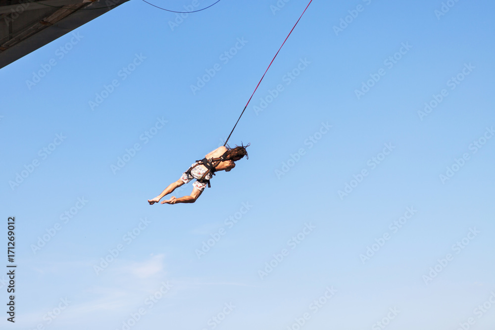 Rope Jumping: people in flight from a height. Rope Jumping: people in flight from a height.