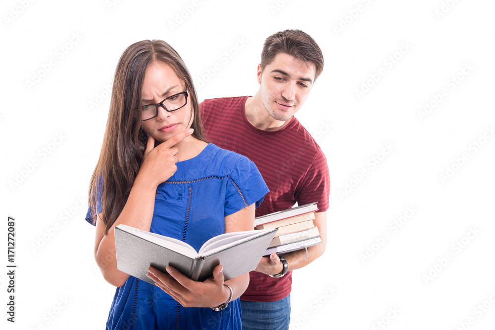 Boyfriend reading from girlfriend's book from behind Boyfriend reading from girlfriend's book from behind