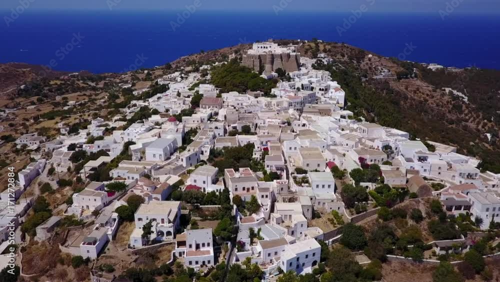 August 2017: Aerial drone video of iconic monastery and medieval castle of Saint John the Theologian with views to chora village, port of Skala and entire Patmos island, Dodecanese, Greece August 2017: Aerial drone video of iconic monastery and medieval castle of Saint John the Theologian with views to chora village, port of Skala and entire Patmos island, Dodecanese, Greece