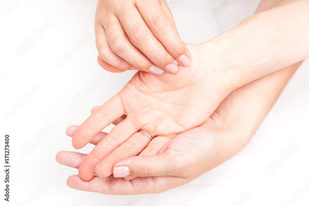 Woman receiving osteopathic treatment of her thumb joint