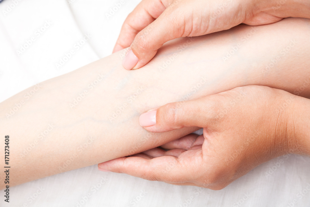 Woman receiving osteopathic treatment of her hand Woman receiving osteopathic treatment of her hand