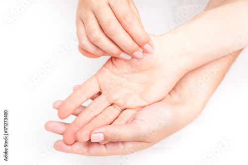 Woman receiving osteopathic treatment of her thumb joint