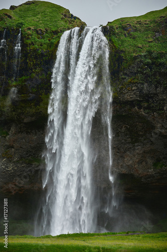 famous Seljalandsfoss waterfall in southern Iceland. treking in Iceland. Travel and landscape photography concept