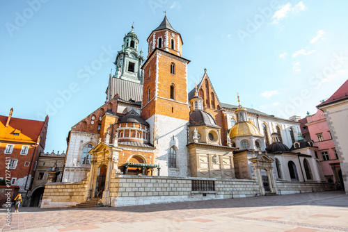 View on the inner courtyard of Wawel castle with chapels and Basilica of saint Stanislaus and Wenceslaus during the sunny morning in Krakow photo