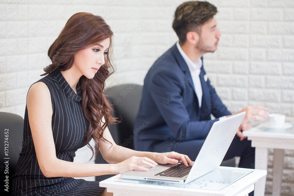 Beautiful Asian Woman using Laptop for Work at office. Smiling Businesswoman work at office Concept. Beautiful Asian Woman using Laptop for Work at office. Smiling Businesswoman work at office Concept.