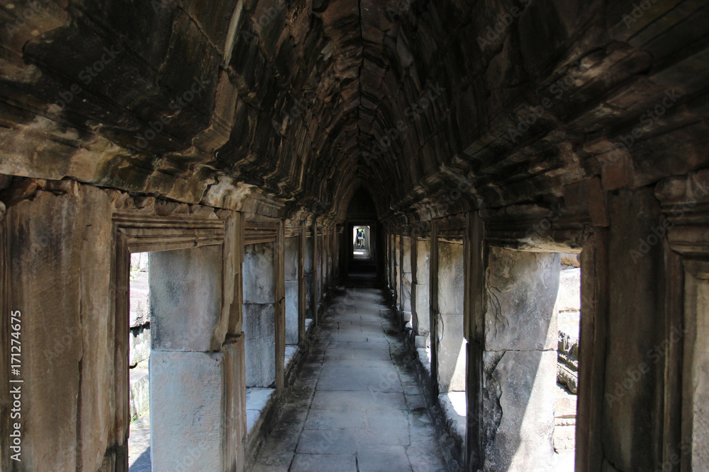 Ruins and walls of an ancient city in Angkor complex, near the ancient capital of Cambodia - Siem Reap