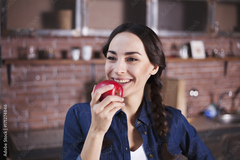Beautiful woman holds red apple in hand and wants to eat it. Beautiful woman holds red apple in hand and wants to eat it.