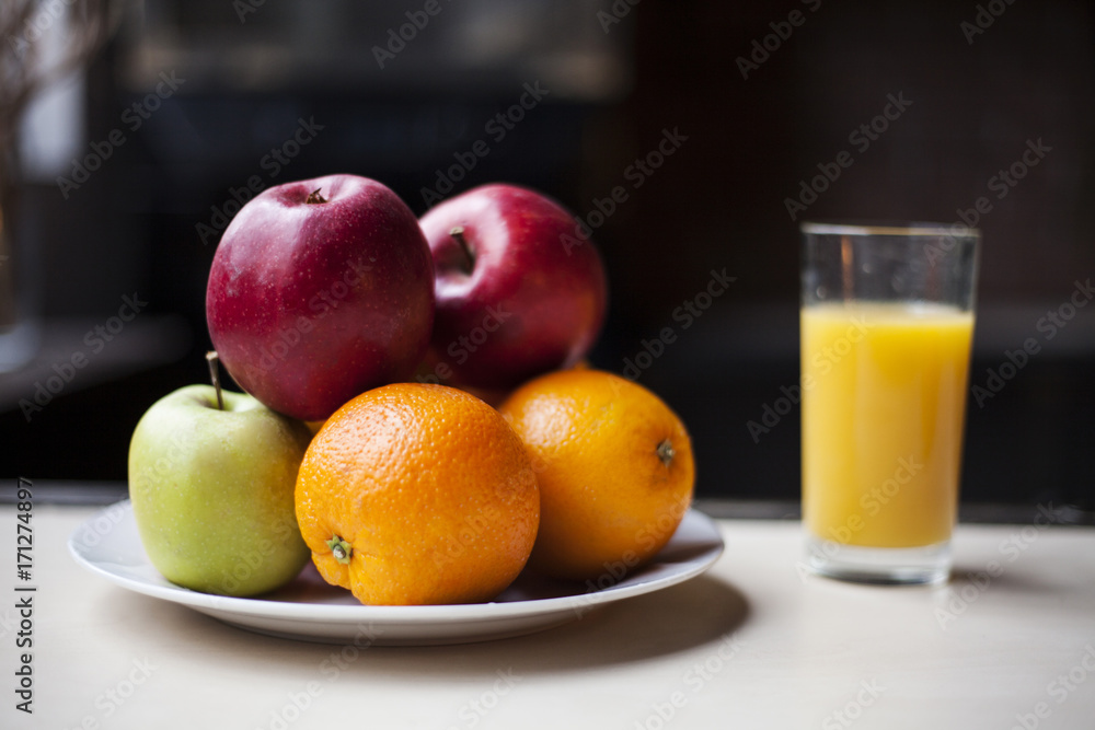 Fruits with orange juice in glass on the table. Fruits with orange juice in glass on the table.